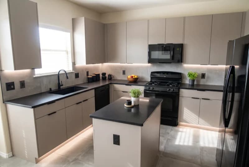 AI-generated sample redesign: Same kitchen redesigned in modern style: flat-panel cabinets, black counters and under-cabinet lighting