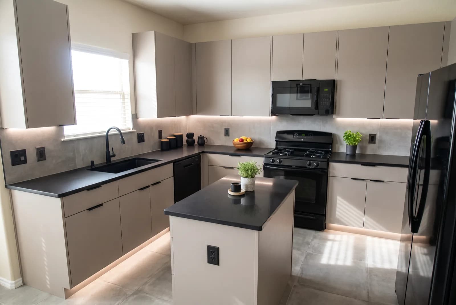 AI-generated sample redesign: Same kitchen redesigned in modern style: flat-panel cabinets, black counters and under-cabinet lighting, after
